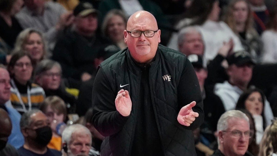 Wake Forest head coach Steve Forbes cheers on his team during the second half of an NCAA college basketball game against Virginia in Winston-Salem, N.C., Saturday, Jan. 21, 2023.