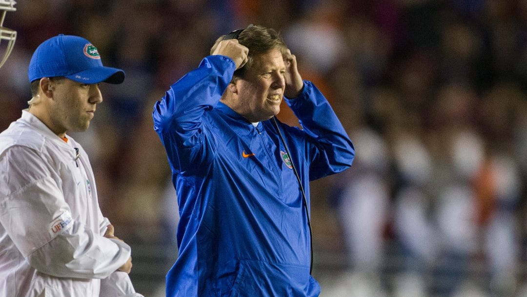 Florida coach Jim McElwain reacts after a player was injured during the first half of the team's NCAA college football game against Florida State in Tallahassee, Fla., Saturday, Nov. 26, 2016. Florida State defeated Florida 33-13.
