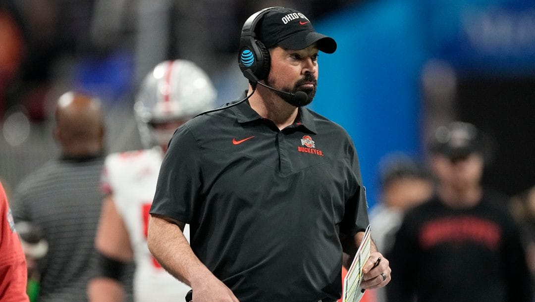 Ohio State head coach Ryan Day walks to the sidelines during the first half of the Peach Bowl NCAA college football semifinal playoff game against Georgia, Saturday, Dec. 31, 2022, in Atlanta.