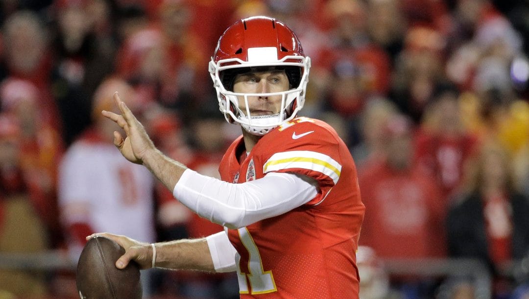 Kansas City Chiefs quarterback Alex Smith (11) looks for a receiver during the first half of an NFL football game against the Los Angeles Chargers in Kansas City, Mo., Saturday, Dec. 16, 2017.