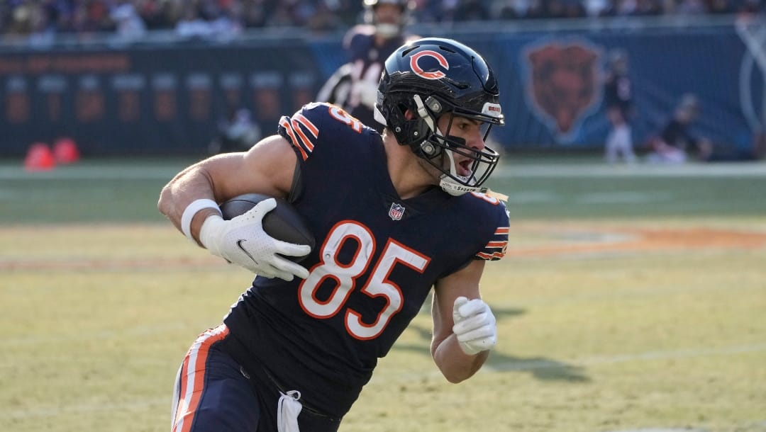 Chicago Bears tight end Cole Kmet runs up field after catching a pass during the second half of an NFL football game against the Minnesota Vikings, Sunday, Jan. 8, 2023, in Chicago.