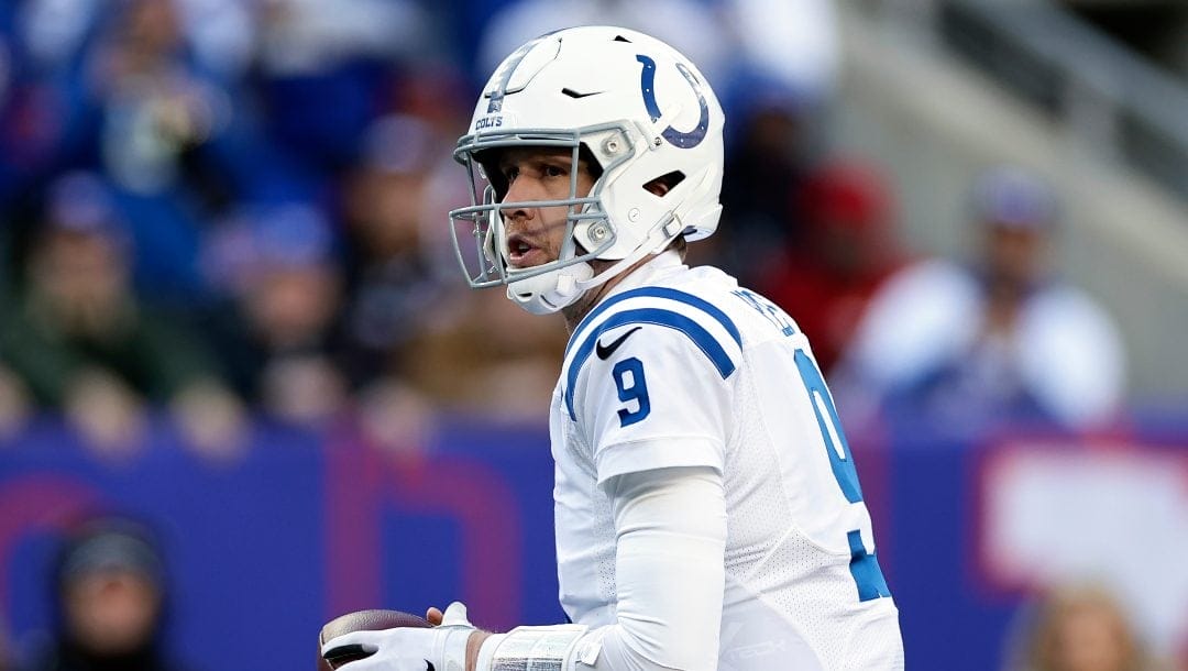 Indianapolis Colts quarterback Nick Foles (9) passes against the New York Giants during an NFL football game Sunday, Jan. 1, 2023, in East Rutherford, N.J.