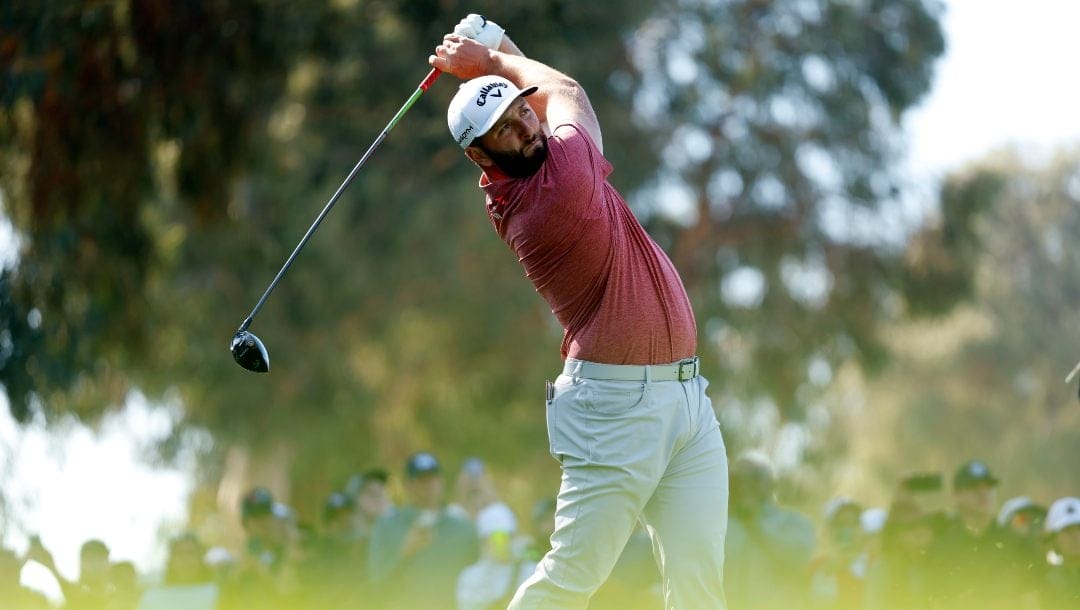 Jon Rahm hits from the ninth tee during the final round of the Genesis Invitational golf tournament at Riviera Country Club, Sunday, Feb. 19, 2023, in the Pacific Palisades area of Los Angeles.