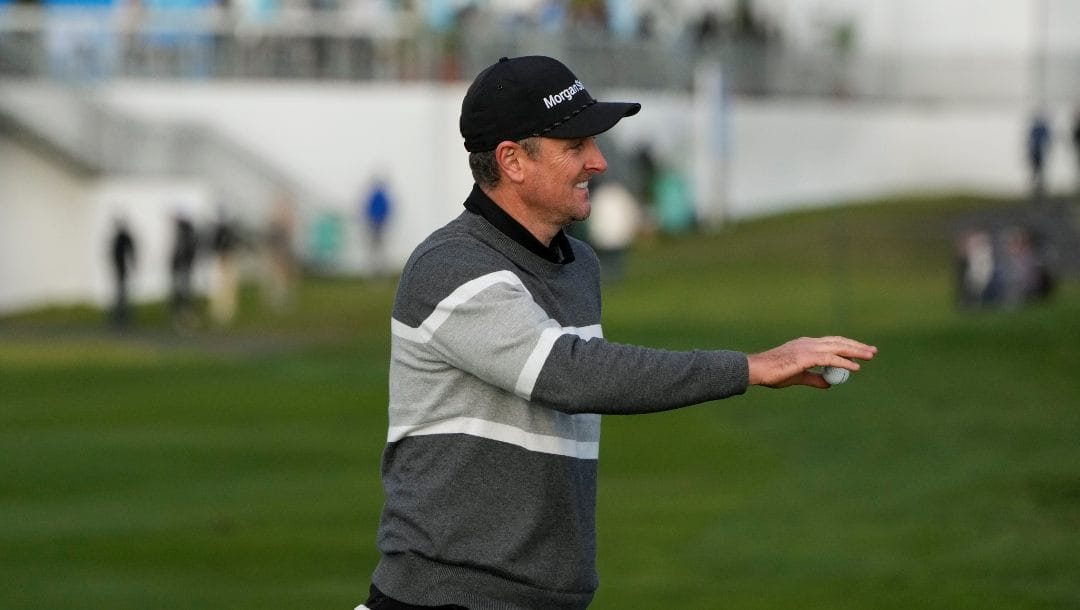 Justin Rose, of England, reacts after making an eagle putt on the sixth green of the Pebble Beach Golf Links during the fourth round of the AT&T Pebble Beach Pro-Am golf tournament in Pebble Beach, Calif., Sunday, Feb. 5, 2023.