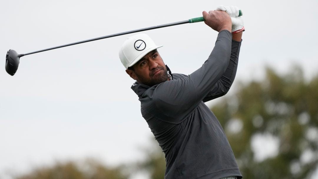 Tony Finau watches his tee shot on the second hole of the South Course at Torrey Pines during the final round of the Farmers Insurance Open golf tournament, Saturday, Jan. 28, 2023, in San Diego.
