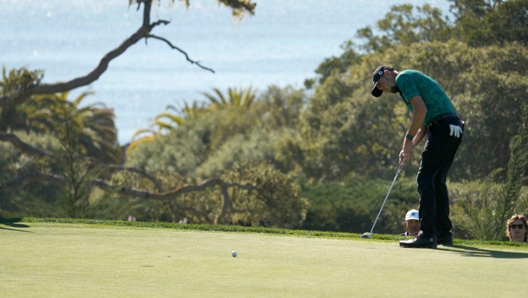 Troy Merritt putts for a birdie on the 14th green of the Pebble Beach Golf Links during the final round of the AT&T Pebble Beach National Pro-Am golf tournament in Pebble Beach, Calif., Sunday, Feb. 6, 2022.