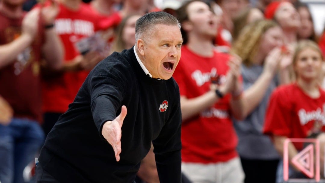 Ohio State coach Chris Holtmann directs the team during the first half of an NCAA college basketball game against Penn State in Columbus, Ohio, Thursday, Feb. 23, 2023. Penn State won 75-71. (AP Photo/Paul Vernon)