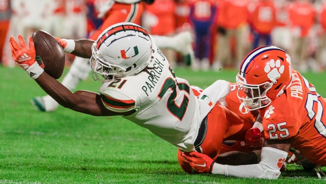 Clemson safety Jalyn Phillips (25) tackles Miami running back Henry Parrish Jr. (21) short of the end zone during the second half of an NCAA college football game Saturday, Nov. 19, 2022, in Clemson, S.C. (AP Photo/Jacob Kupferman)