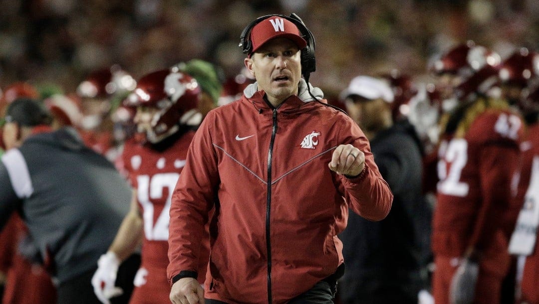 Washington State head coach Jake Dickert walks on the sideline during the second half of an NCAA college football game against Washington, Saturday, Nov. 26, 2022, in Pullman, Wash. (AP Photo/Young Kwak)