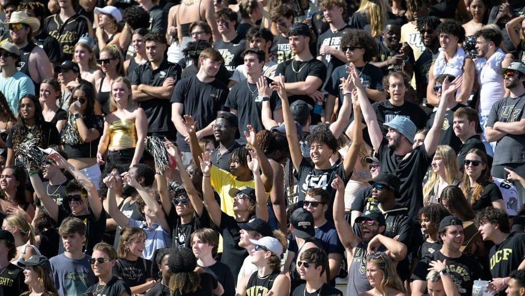 Central Florida fans cheer in the stands before an NCAA college football game against Georgia Tech, Saturday, Sept. 24, 2022, in Orlando, Fla. (AP Photo/Phelan M. Ebenhack)