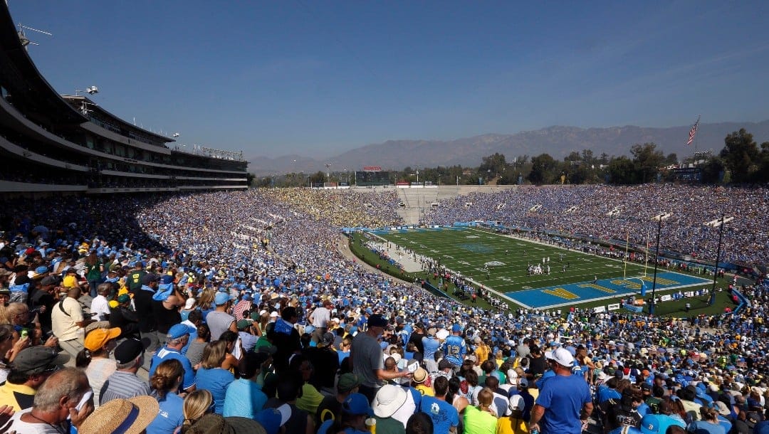 FILE - UCLA plays Oregon during a Pac-12 NCAA college football game at the Rose Bowl in Pasadena, Calif., Oct. 11, 2014. There are 23 venues bidding to host soccer matches at the 2026 World Cup in the United States, Mexico and Canada. (AP Photo/Doug Benc, File)