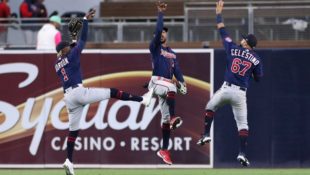 Minnesota Twins' Nick Gordon (1), Byron Buxton and Gilberto Celestino (67) celebrate the team's win over the San Diego Padres in a baseball game Saturday, July 30, 2022, in San Diego.