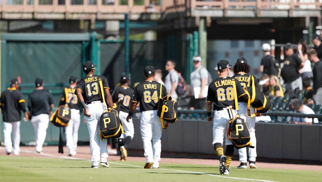 Members of the Pittsburgh Pirates leave the field after a spring training baseball game against the Toronto Blue Jays, Thursday, March 12, 2020, in Bradenton, Fla.