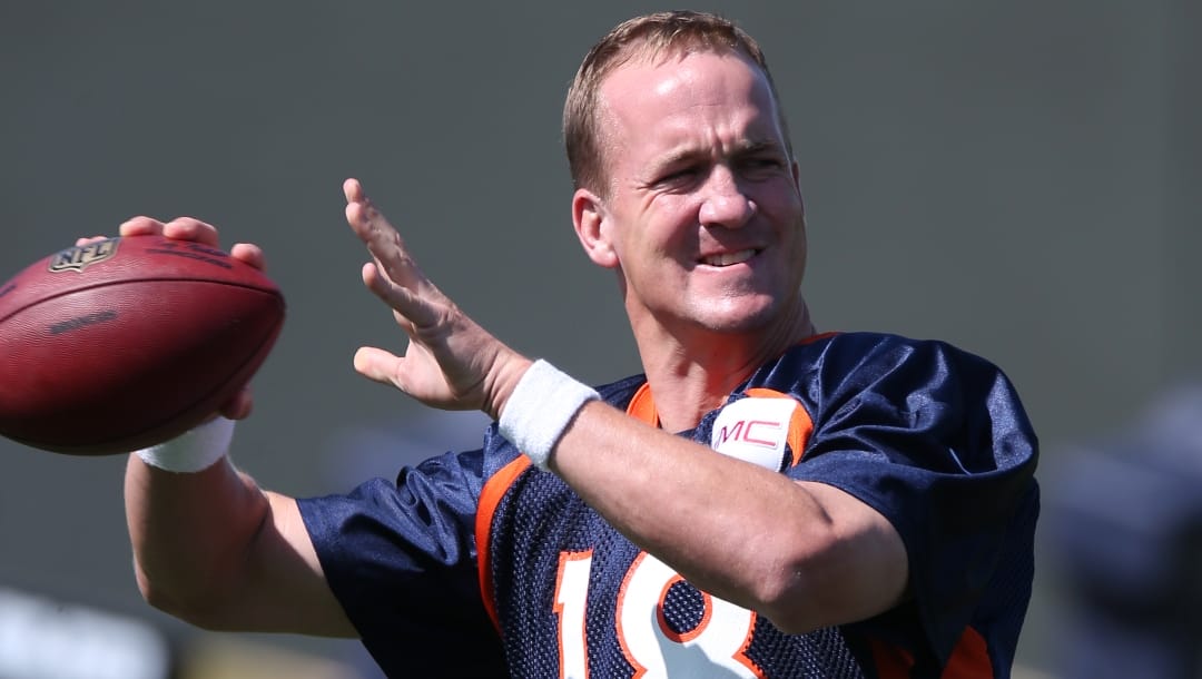 Then-Denver Broncos quarterback Peyton Manning throws