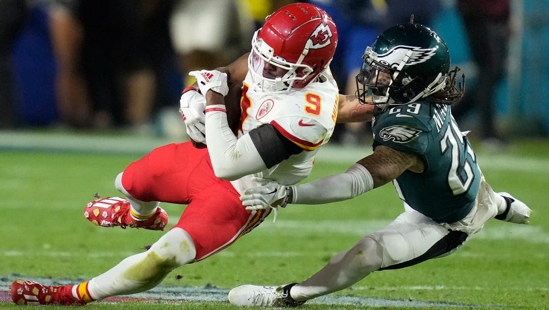 Kansas City Chiefs wide receiver JuJu Smith-Schuster (9) falls to the turf