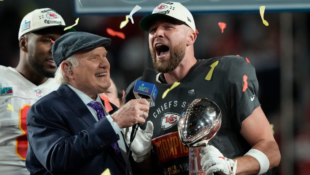 Kansas City Chiefs tight end Travis Kelce (87) holds the Lombardi Trophy