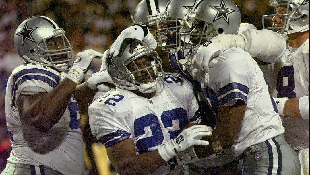 Dallas Cowboys teammates celebrate Emmitt Smith’s (22) second touchdown against the Pittsburgh Steelers during Super Bowl XXX, Jan. 28, 1996, in Tempe, Ariz. The Cowboys never trailed, winning 27-17 to tie the San Francisco 49ers with five Super Bowl championships, while the Steelers lost for the first time in five appearances. (AP Photo/Susan Ragan)