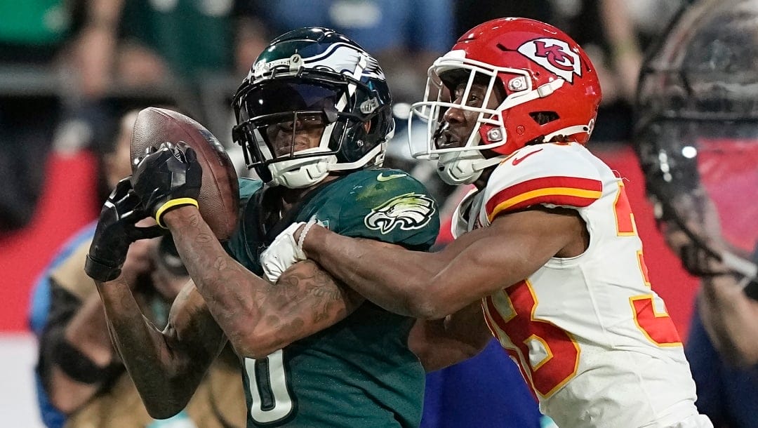 Philadelphia Eagles wide receiver DeVonta Smith, left, plays