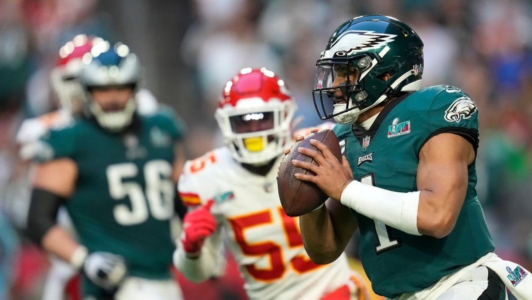 Philadelphia Eagles quarterback Jalen Hurts (1) looks to pass against the Kansas City Chiefs during the first half of the NFL Super Bowl 57 football game between the Kansas City Chiefs and the Philadelphia Eagles, Sunday, Feb. 12, 2023, in Glendale, Ariz. (AP Photo/Ashley Landis)