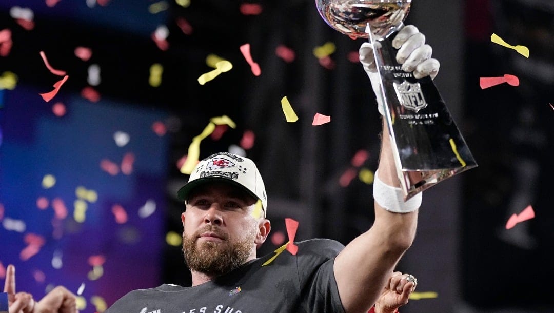 Kansas City Chiefs tight end Travis Kelce holds the Vince Lombardi Trophy after the NFL Super Bowl 57 football game against the Philadelphia Eagles, Sunday, Feb. 12, 2023, in Glendale, Ariz. The Kansas City Chiefs defeated the Philadelphia Eagles 38-35. (AP Photo/Brynn Anderson)