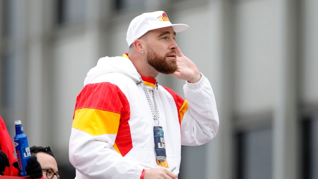 Kansas City Chiefs tight end Travis Kelce reacts as he rides in a victory parade through downtown Kansas City, Mo., Wednesday, Feb. 15, 2023, while celebrating his team's NFL Super Bowl 57 win with fans. (AP Photo/Colin E. Braley)