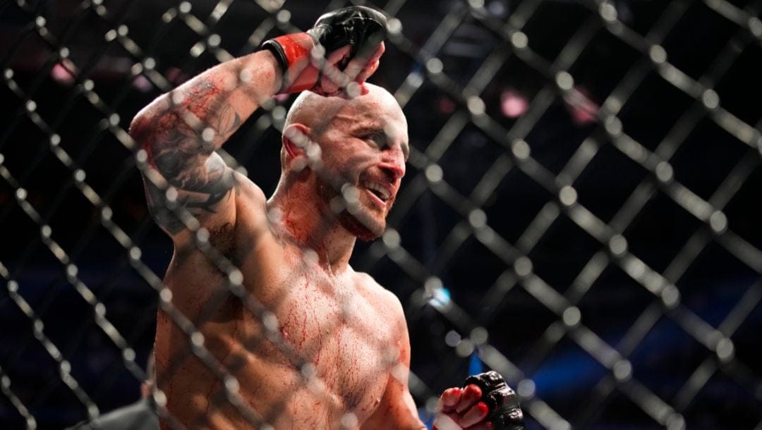 Alexander Volkanovski reacts after winning a featherweight title bout against Max Holloway during the UFC 276 mixed martial arts.