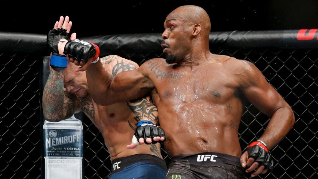 Jon Jones, right, fights Anthony Smith in a light heavyweight mixed martial arts title bout at UFC 235, Saturday, March 2, 2019.