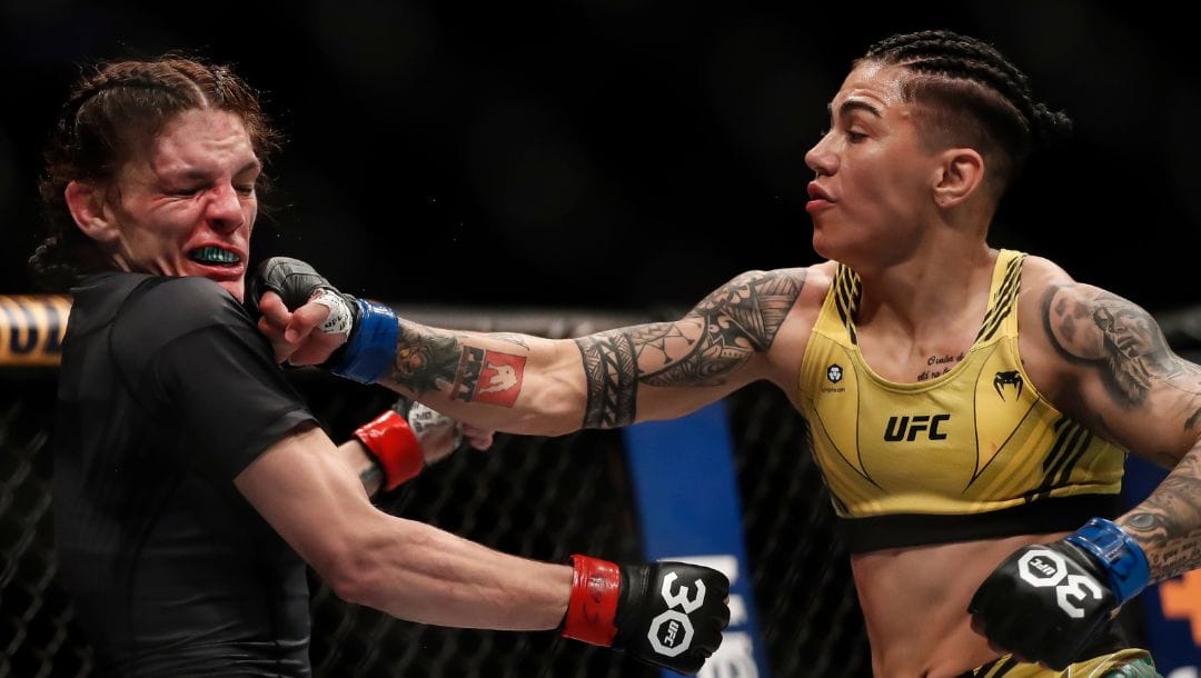 Brazil's Jessica Andrade, right, punches United States' Lauren Murphy during a women's flyweight bout at the UFC 283.