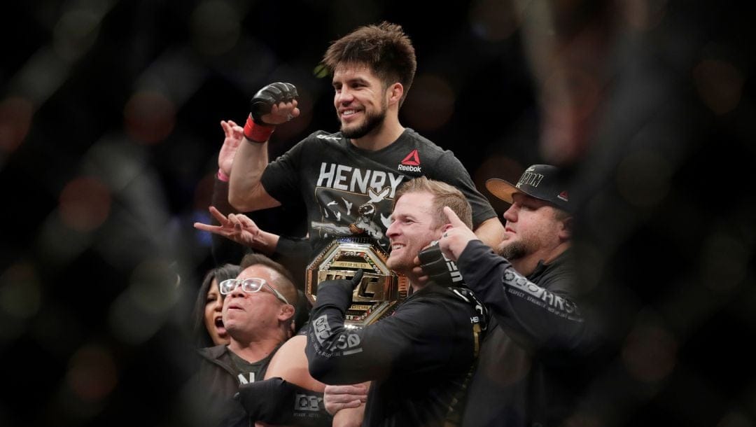 Henry Cejudo celebrates after a flyweight mixed martial arts championship bout against TJ Dillashaw at UFC Fight Night.