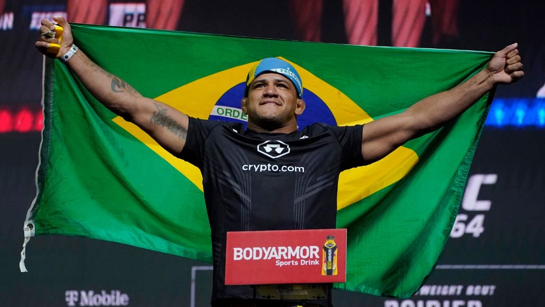 Gilbert Burns poses during a ceremonial weigh-in for a UFC 264 mixed martial arts bout Friday, July 9, 2021, in Las Vegas.