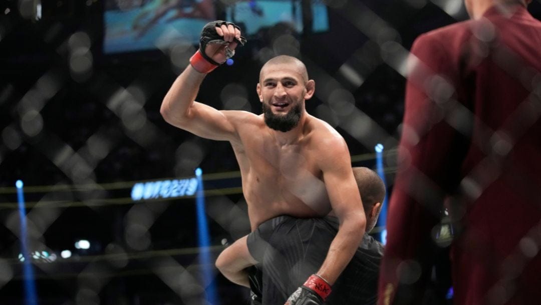 Khamzat Chimaev celebrates after defeating Kevin Holland in a 180-pound catchweight bout during the UFC 279.