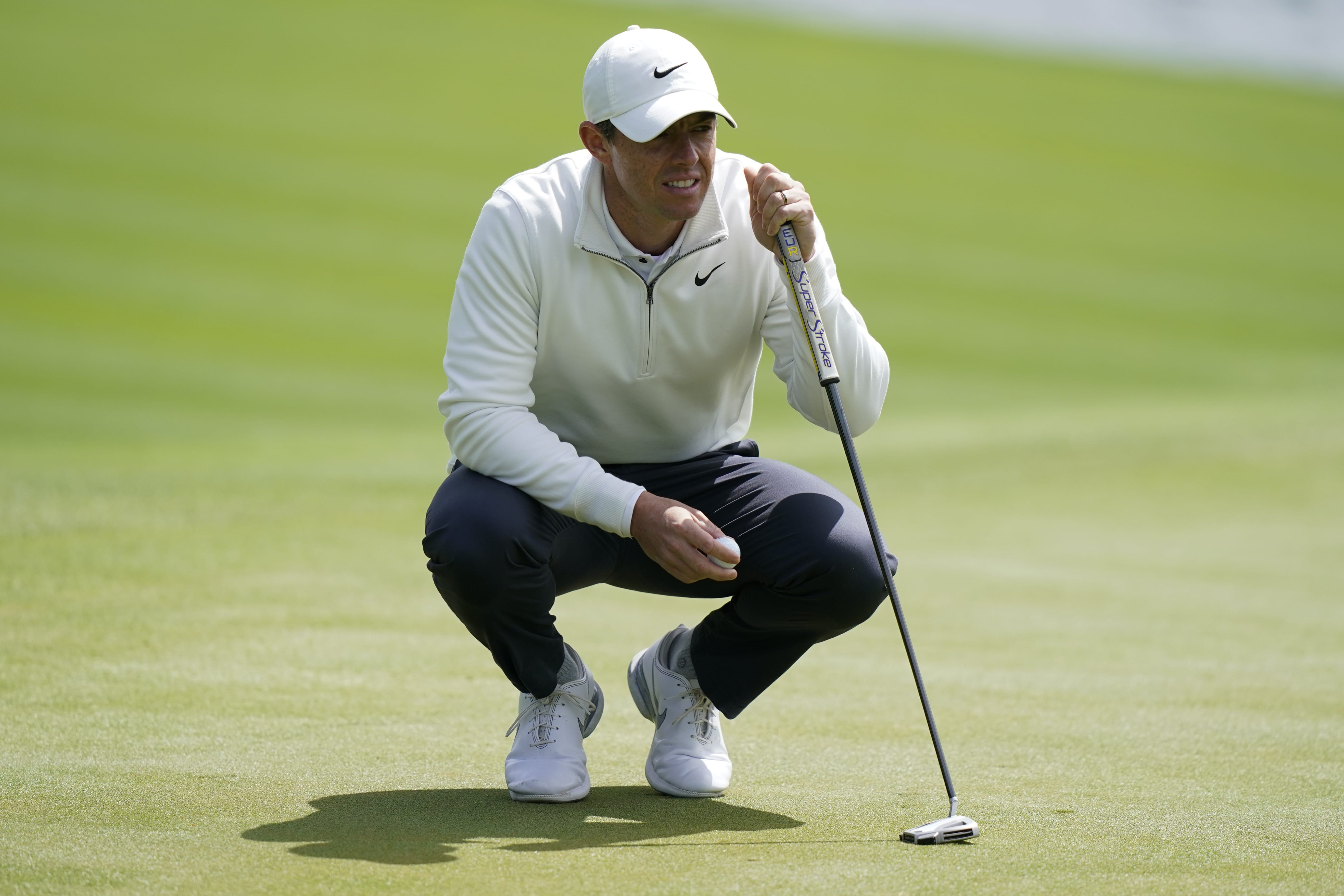 Rory McIlroy, of Northern Ireland, lines up his putt on the 18th hole during the first round of play in The Players Championship golf tournament Saturday, March 12, 2022, in Ponte Vedra Beach, Fla.