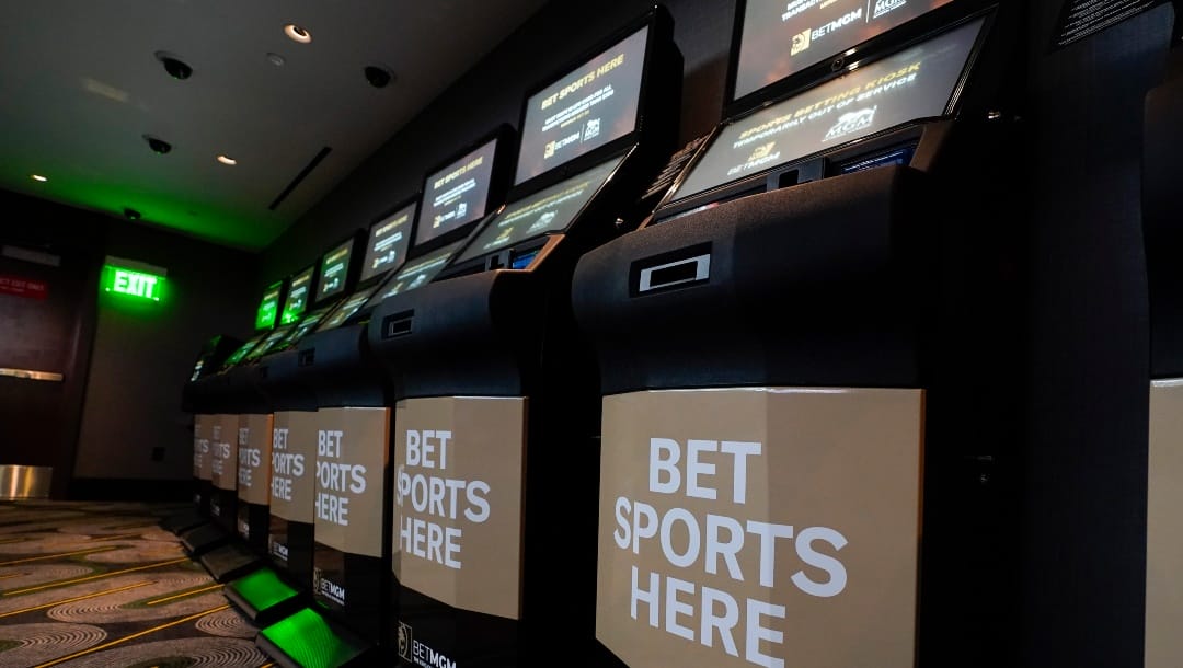 Betting kiosks are seen at the new MGM National Harbor sportsbook, Thursday, Dec. 9, 2021, in Oxon Hill, Md. Maryland officially started taking sports bets Thursday, when Larry Hogan was among the first people to make a sports wager at the casino. (AP Photo/Julio Cortez)