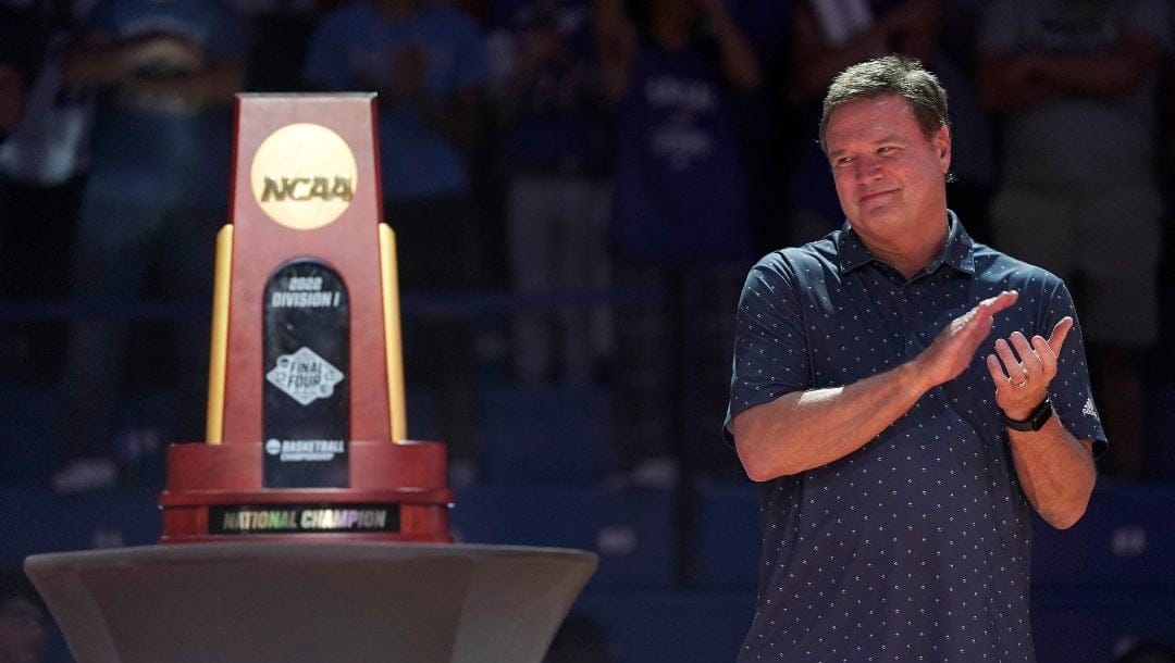 Kansas head coach Bill Self applauds last season's national championship team during Late Night in the Phog, the school's annual NCAA college basketball kickoff, at Allen Fieldhouse, Friday, Oct. 14, 2022, in Lawrence, Kan. Kansas and Baylor tied for No. 5 in the preseason AP Top 25 men's basketball poll released Monday, Oct. 17, 2022.