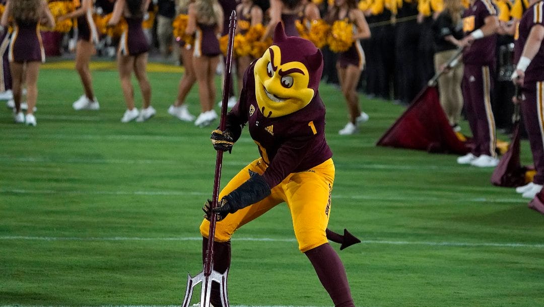 Arizona State's mascot Sparky sticks a pitchfork into Sun Devil stadium before the first half of an NCAA college football game against Eastern Michigan Saturday, Sept. 17, 2022, in Tempe, Ariz.