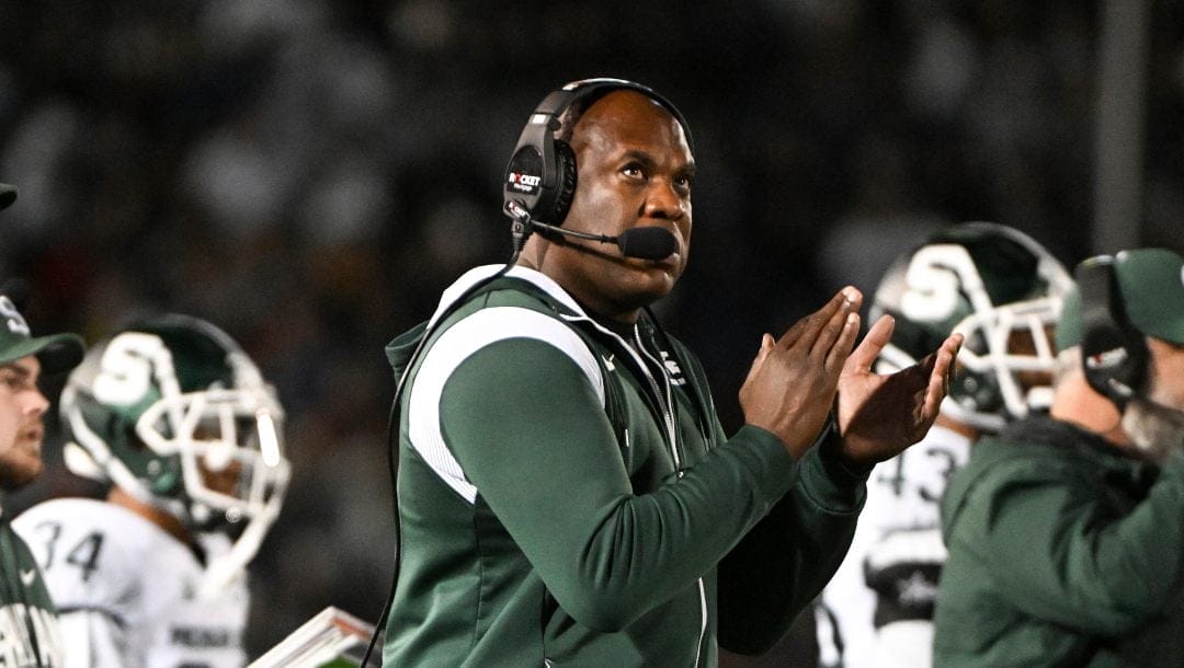 Michigan State coach Mel Tucker applauds during the team's NCAA college football game against Penn State, Saturday, Nov. 26, 2022, in State College, Pa.