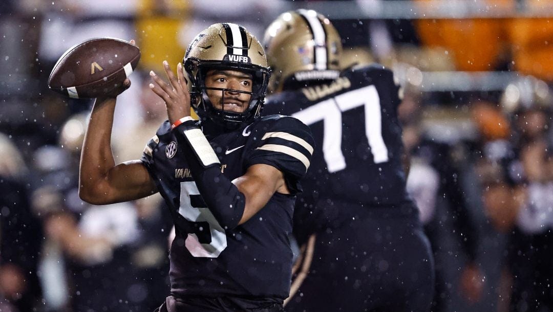 Vanderbilt quarterback Mike Wright (5) throws to a receiver during the first half of the team's NCAA college football game against Tennessee, Saturday, Nov. 26, 2022, in Nashville, Tenn.
