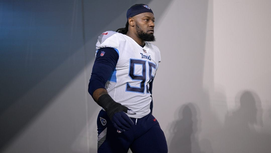 Tennessee Titans defensive end Denico Autry (96) walks to the field before an NFL football game against the Jacksonville Jaguars, Saturday, Jan. 7, 2023, in Jacksonville, Fla.