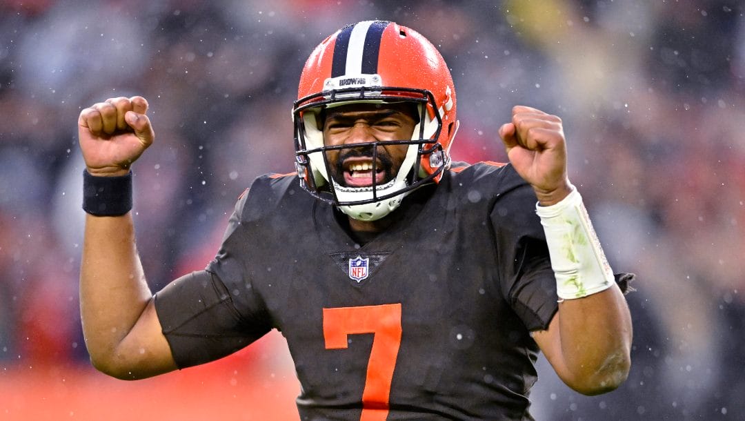 Cleveland Browns quarterback Jacoby Brissett (7) celebrates after handing the ball off to running back Nick Chubb, who scored in overtime of the team's NFL football game against the Tampa Bay Buccaneers in Cleveland, Sunday, Nov. 27, 2022. Jacoby Brissett has agreed to terms with the Washington Commanders on a one-year contract worth $10 million with $8 million guaranteed, according to a person with knowledge of the deal. The person spoke to The Associated Press on condition of anonymity Wednesday, March 15, 2023 because the team had not announced the contract.