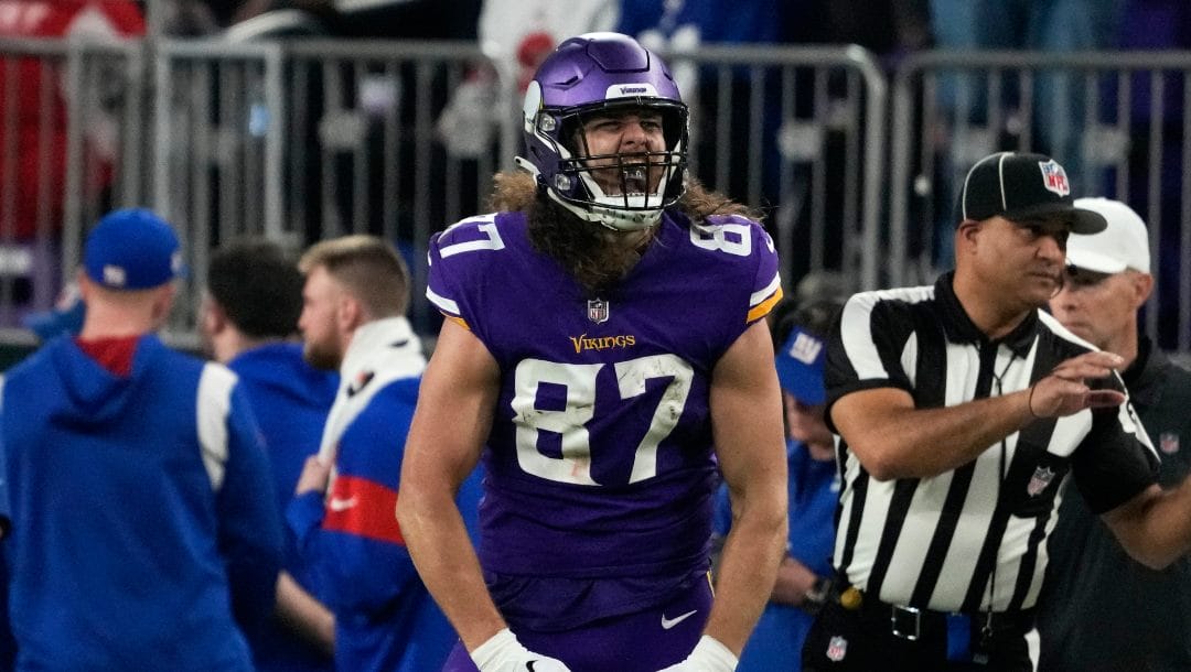 Minnesota Vikings tight end T.J. Hockenson (87) celebrates after catching a pass during the first half of an NFL wild card playoff football game against the New York Giants, Sunday, Jan. 15, 2023, in Minneapolis.