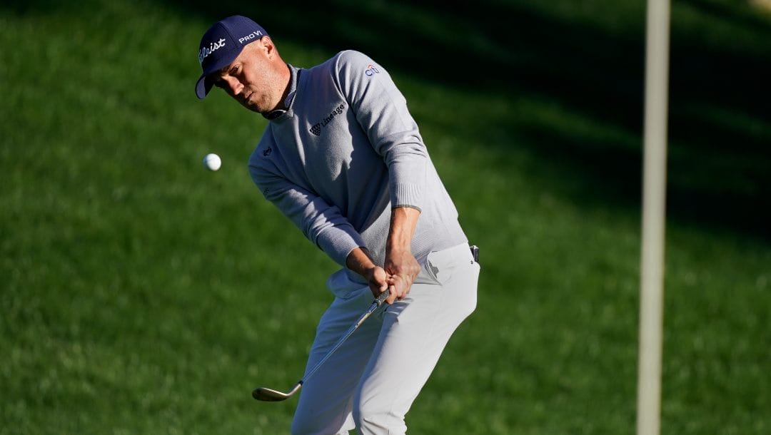 Justin Thomas chips to the sixth green during the third round of play in The Players Championship golf tournament Sunday, March 13, 2022, in Ponte Vedra Beach, Fla.