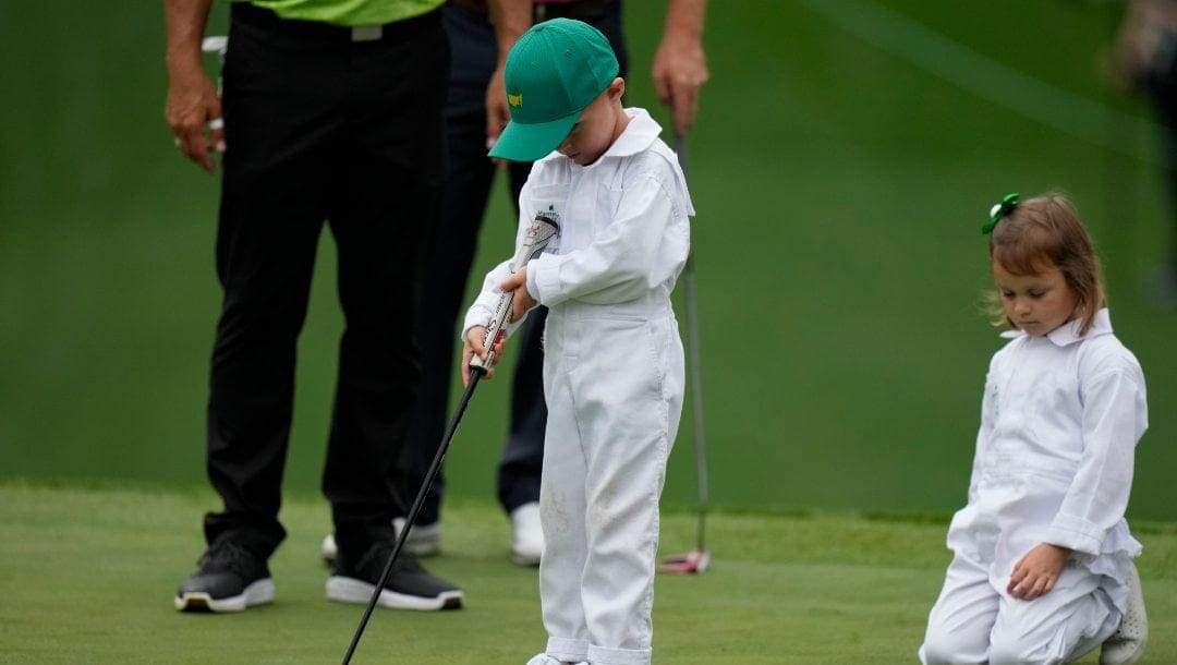 Gary Woodland’s son Jackson putts on the first green during the Par 3 contest at the Masters golf tournament on Wednesday, April 6, 2022, in Augusta, Ga.