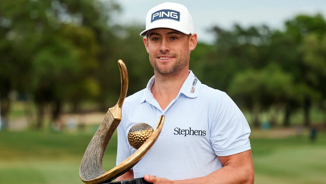 Taylor Moore holds the trophy after winning the Valspar Championship golf tournament Sunday, March 19, 2023, at Innisbrook in Palm Harbor, Fla.