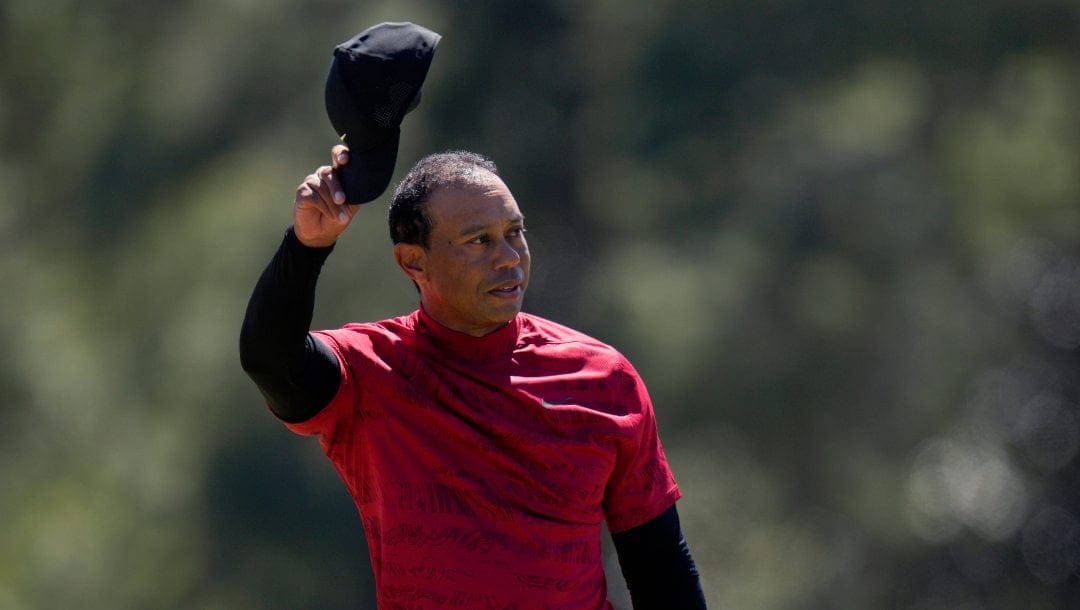 Tiger Woods tips his cap on the 18th green during the final round at the Masters golf tournament on Sunday, April 10, 2022, in Augusta, Ga. Tiger Woods returns to the Masters, no longer a surprise as it was a year ago but no less a rare appearance.