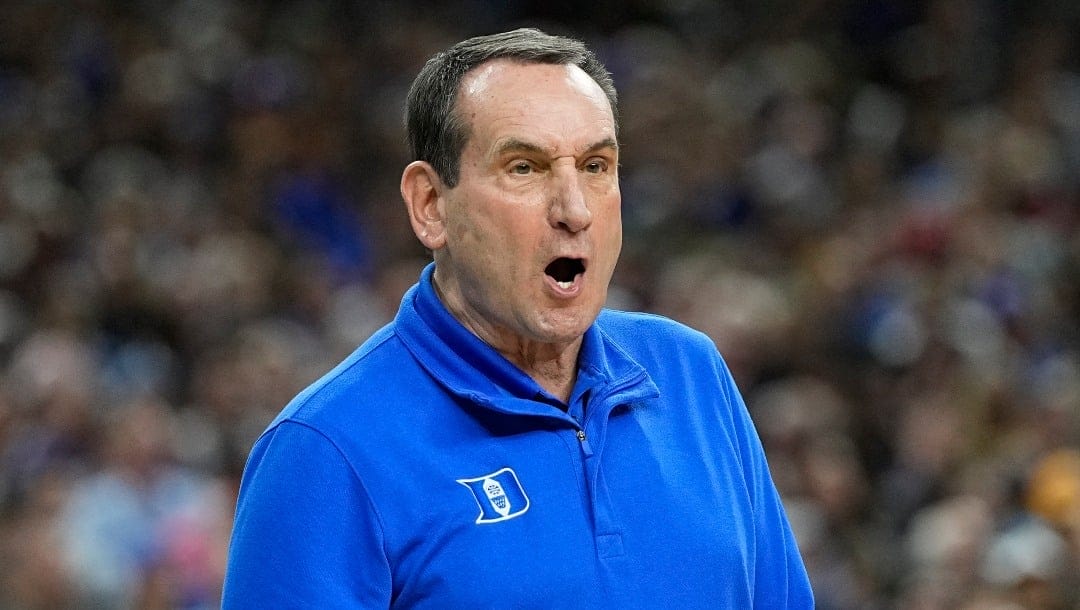 Duke head coach Mike Krzyzewski yells to his players during the first half of a college basketball game against North Carolina in the semifinal round of the Men's Final Four NCAA tournament, Saturday, April 2, 2022, in New Orleans. (AP Photo/David J. Phillip)