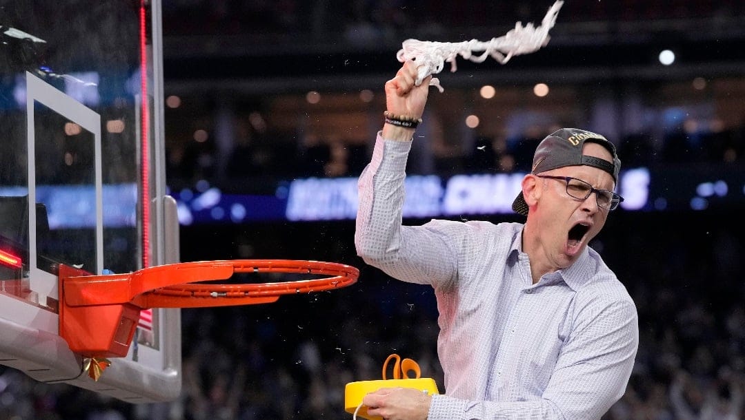 Connecticut head coach Dan Hurley celebrates during the net cutting after their win against San Diego State in the men's national championship college basketball game in the NCAA Tournament on Monday, April 3, 2023, in Houston. (AP Photo/David J. Phillip)