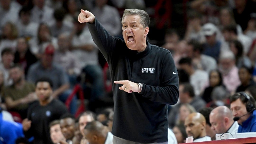 Kentucky coach John Calipari reacts to a call during the second half of an NCAA college basketball game against Arkansas, Saturday, March 4, 2023, in Fayetteville, Ark. (AP Photo/Michael Woods)