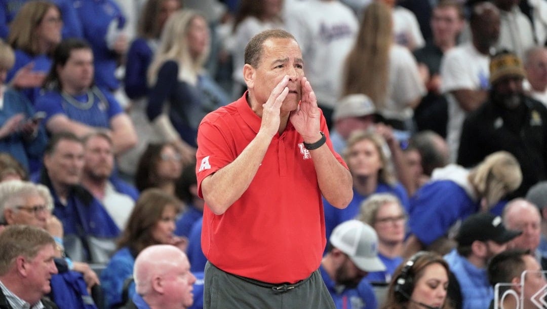 Houston head coach Kelvin Sampson shouts to his players in the second half of an NCAA college basketball game against Memphis Sunday, March 5, 2023, in Memphis, Tenn. (AP Photo/Karen Pulfer Focht)