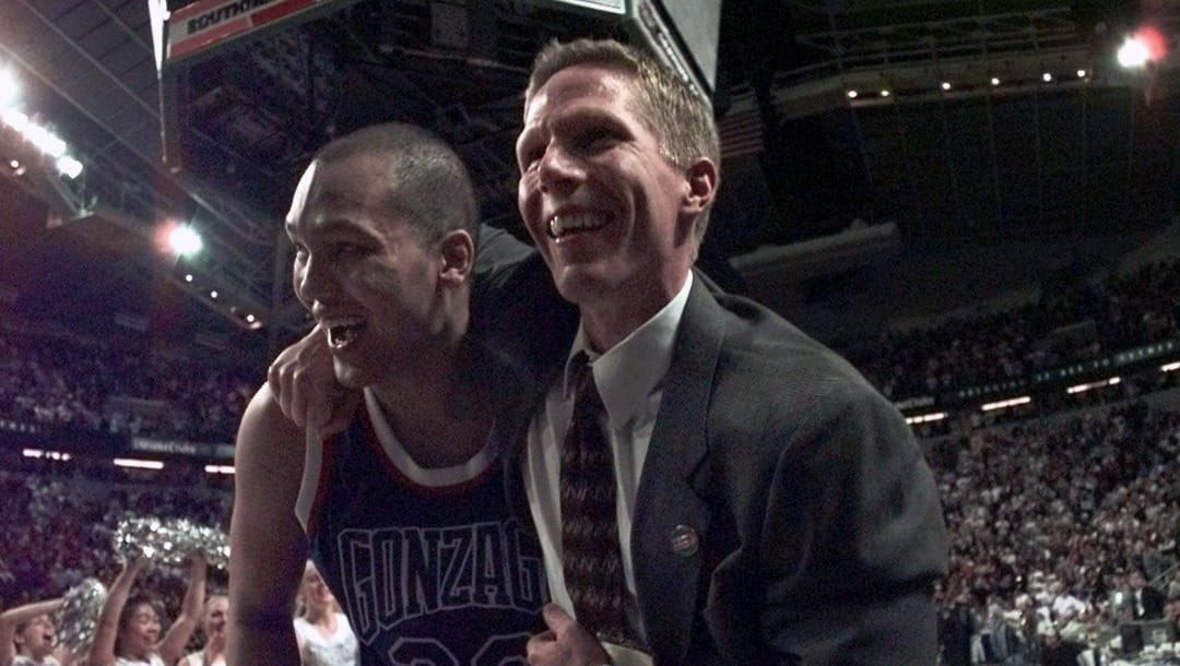 Gonzaga's Mike Leasure, left, and assistant coach Mark Few celebrate after they beat Stanford 82-74 in the NCAA west regional second round game at the Key Arena in Seattle, Saturday, March 13, 1999. (AP Photo/Elaine Thompson)