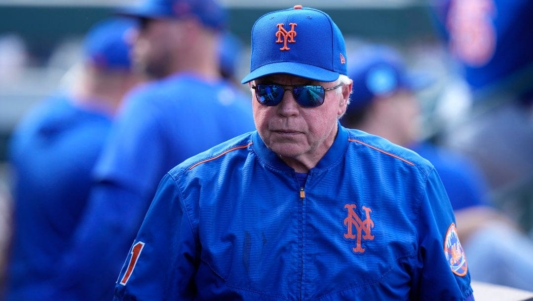 New York Mets manager Buck Showalter walks in the dugout during a spring training baseball game against the Miami Marlins, Saturday, March 4, 2023, in Jupiter, Fla.